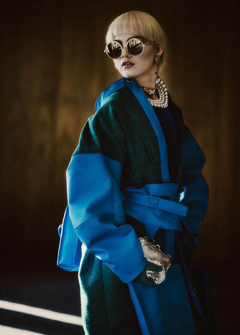 Blue mix tailored coat, €950, Tara Woulfe Design (Mallow College of Design & Tailoring, Cork). Blue fringed dress, €585, Sheena’s Boutique, Cork. Leather gloves, €69, Monreal, Cork.   Star choker, €7, from Topshop. Vintage resin earrings, €29, and retro sunnies, €30, The Hummingbird Bird Room, Cork