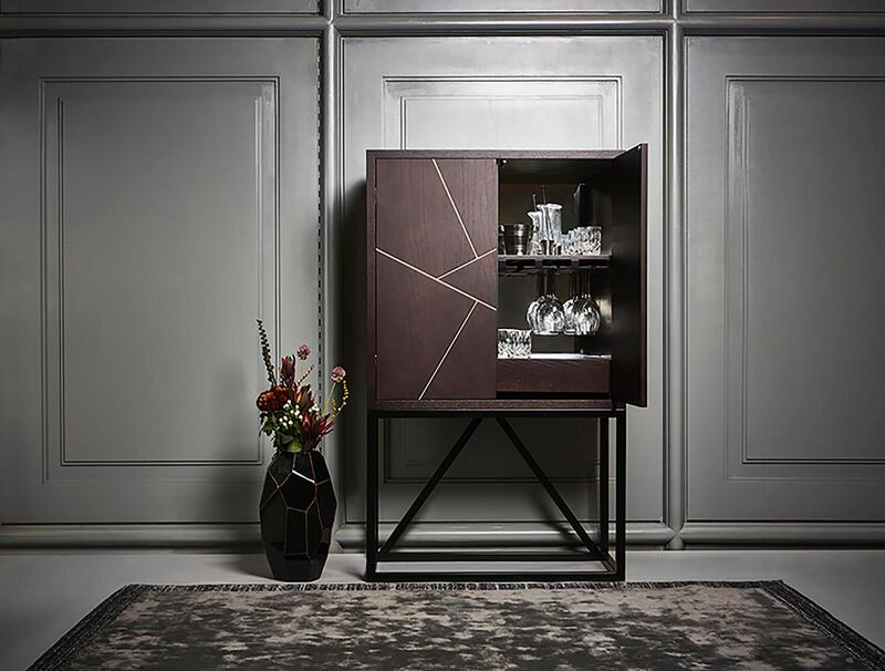Oak veneer drinks cabinet with brass inlay on doors and black metal legs. Measures 10x45x90cms and priced at €1800