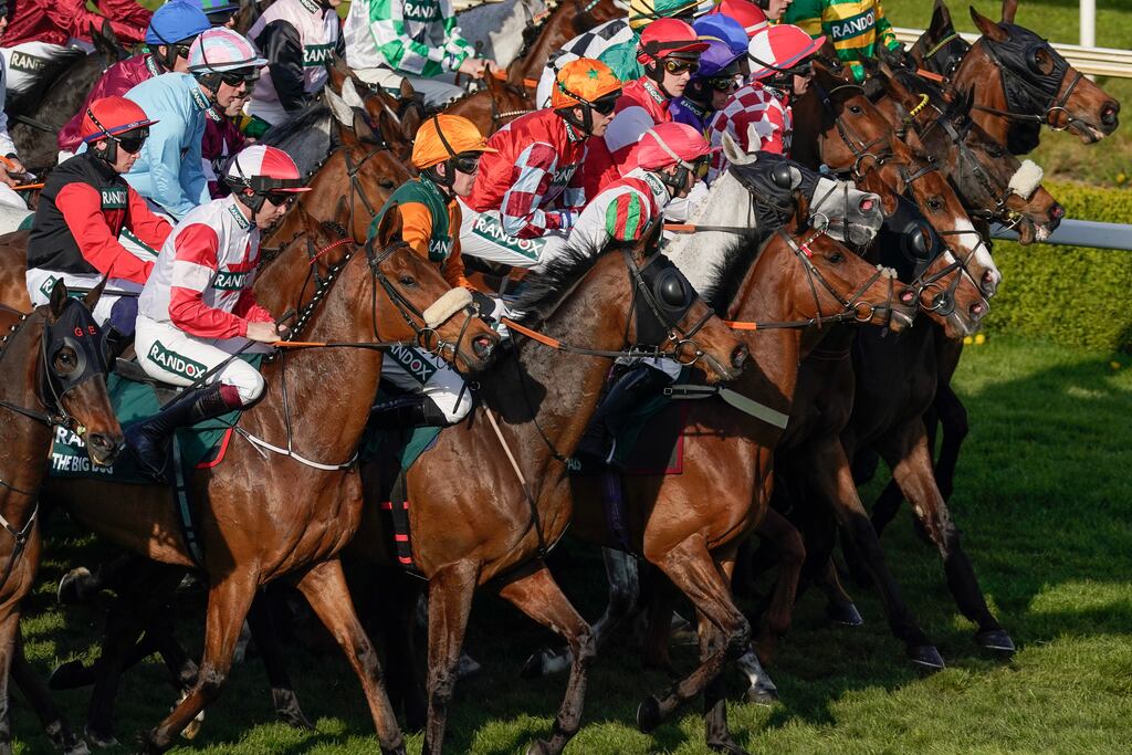 Runners line up at the start of the Grand National at Aintree Racecourse on Saturday evening in Liverpool, England. Photograph: Alan Crowhurst/Getty Images