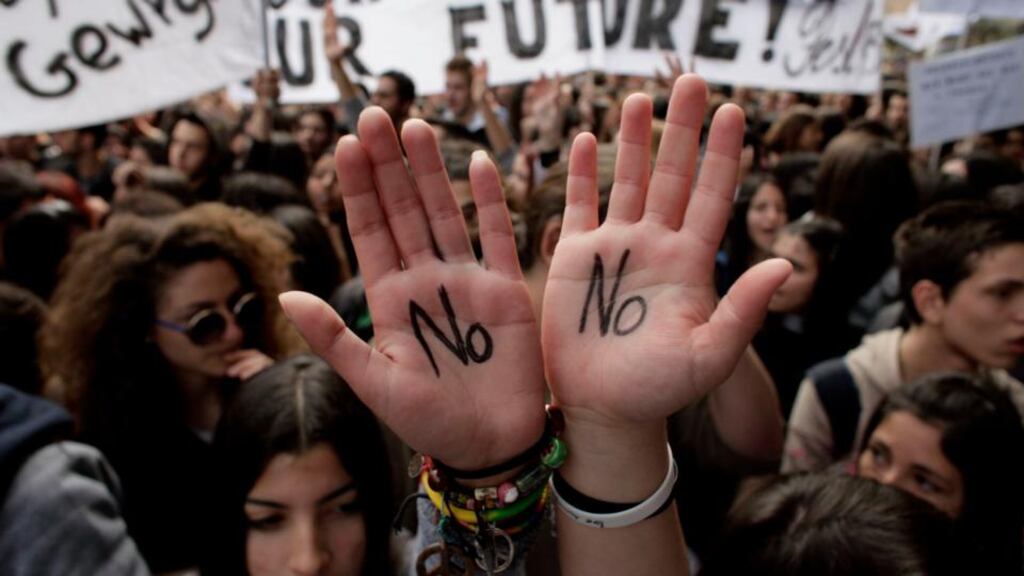 Students protest against austerity measures in front of the Cypriot parliament building yesterday. Photograph: Milos Bicanski/Getty Images
