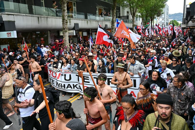 Maori people march through the central business district of Wellington as part of the demonstration. Photograph: Mark Tantrum/AP