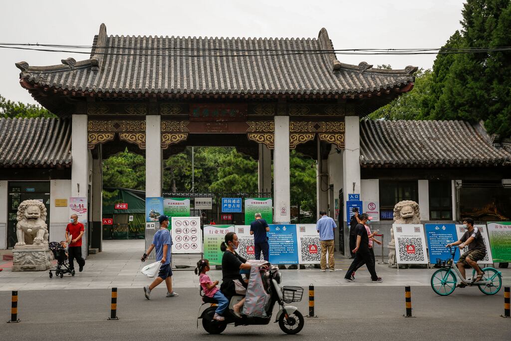 People scanning health codes before entering a park in Beijing, China. Photograph: Mark R Cristino/EPA