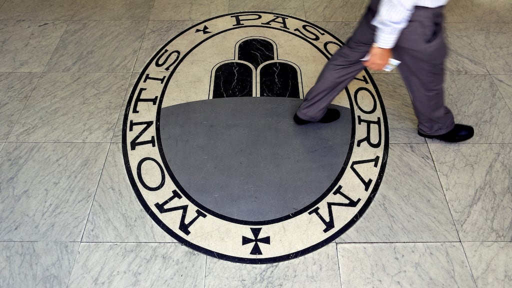 A man walks on the logo of the Monte dei Paschi di Siena bank in Rome. Photograph: Alessandro Bianchi/Reuters