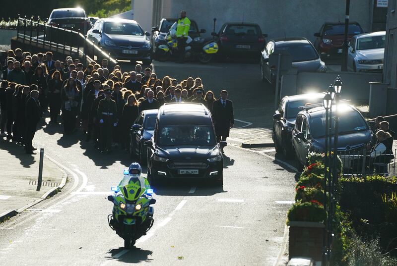 Family and mourners walk behind the hearse carrying the coffin of Martina Martin on their way to St Michael's Church, in Creeslough, for her funeral Mass. Photograph: Brian Lawless/PA Wire