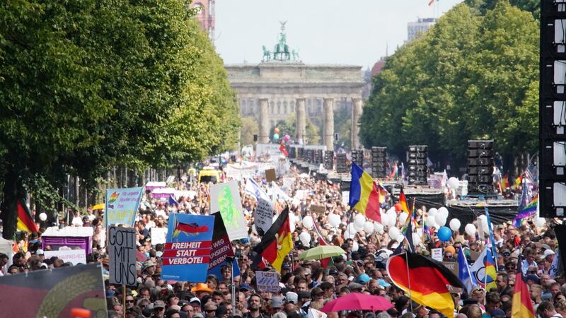 Demonstrators march during a protest against coronavirus pandemic regulations in front of the Brandenburg Gate in Berlin, on Saturday. Photograph: EPA