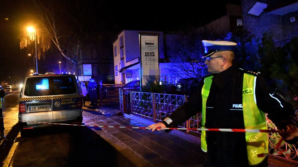 Police secure a scene of a fire in Koszalin, Poland, after five 15 year old girls were killed in a fire. Photograph: EPA
