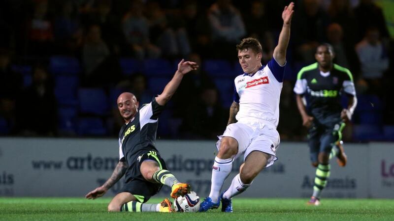 Tranmere Rovers Max Power is tackled by Stoke City goalscorer Stephen Ireland at Prenton Park. Photograph: Peter Byrne/PA Wire
