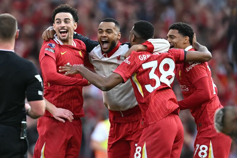 Curtis Jones, Cody Gakpo, Ryan Gravenberch and Jarell Quansah celebrate winning the Premier League title at Anfield. Photograph: Paul Ellis/AFP via Getty Images