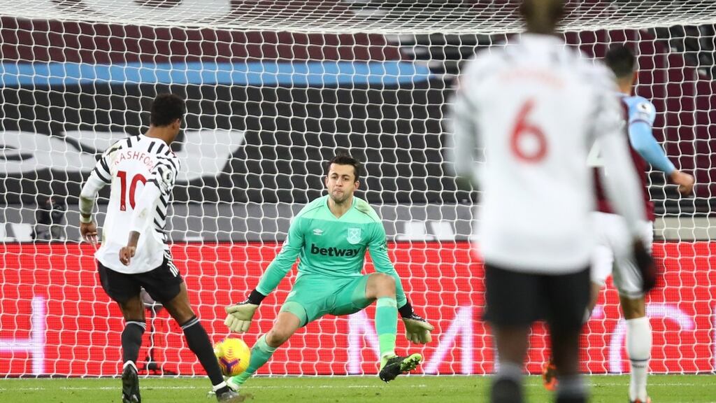 Manchester United’s Marcus Rashford chips the goalkeeper for the third goal of the game in their win over West Ham. Photo: Julian Finney/EPA
