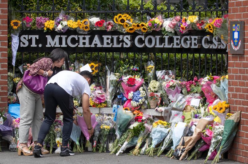 Floral tributes were left outside St Michael's College in memory of Andrew O'Donnell and Max Wall. Photograph: Colin Keegan/Collins