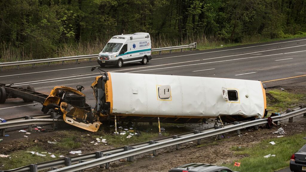 The scene where a school bus collided with a dump truck on Route I-80 in Mount Olive Township, New Jersey. Photograph: Bryan Anselm/The New York Times