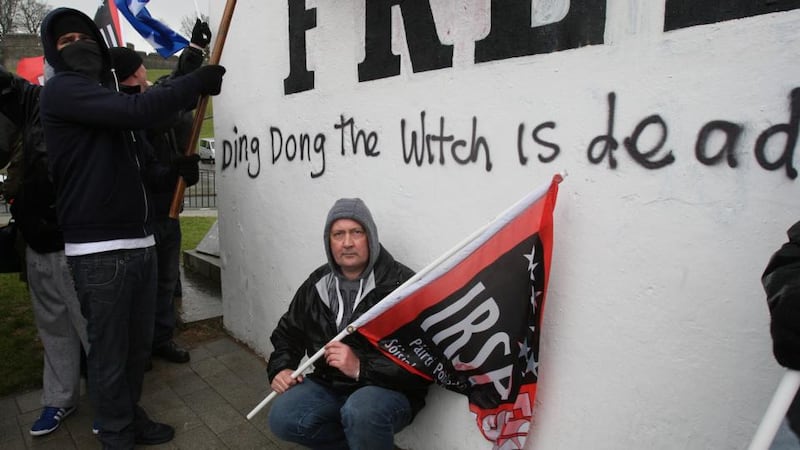 Republicans in the bogside area of Derry, mark the death of Margaret Thatcher, carrying a poster referring to the INLA murder of Tory MP Airey Neave. Photograph: PA
