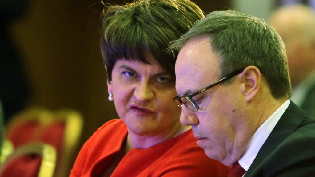 DUP leader Arlene Foster chats with her deputy Nigel Dodds during their party’s annual conference at the La Mon hotel in Belfast. Photograph: Paul McErlane/EPA