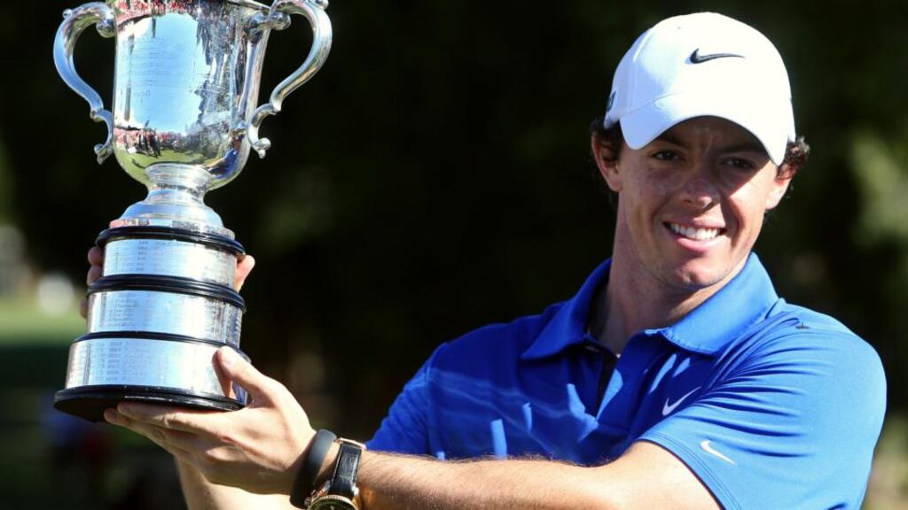 Rory McIlroy holds aloft the Stonehaven Cup   after winning the Australian Open  at Royal Sydney Golf Club. Photograph: Steve Christo/Reuters