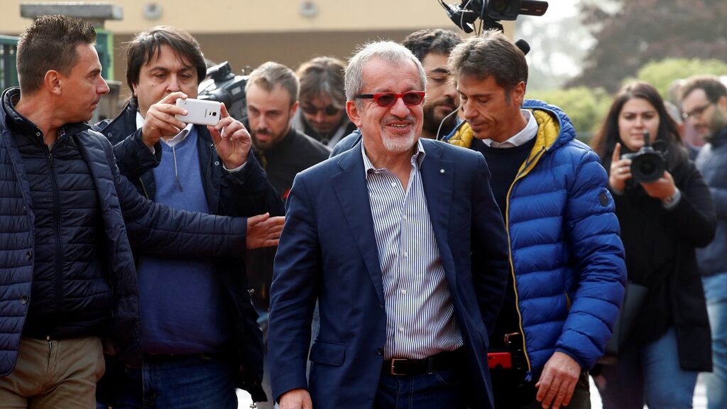 President of Lombardy Roberto Maroni arrives to cast his electronic vote for Lombardy’s autonomy referendum at a polling station in Lozza near Varese, northern Italy, on Sunday. Photograph: Alessandro Garofalo/Reuters