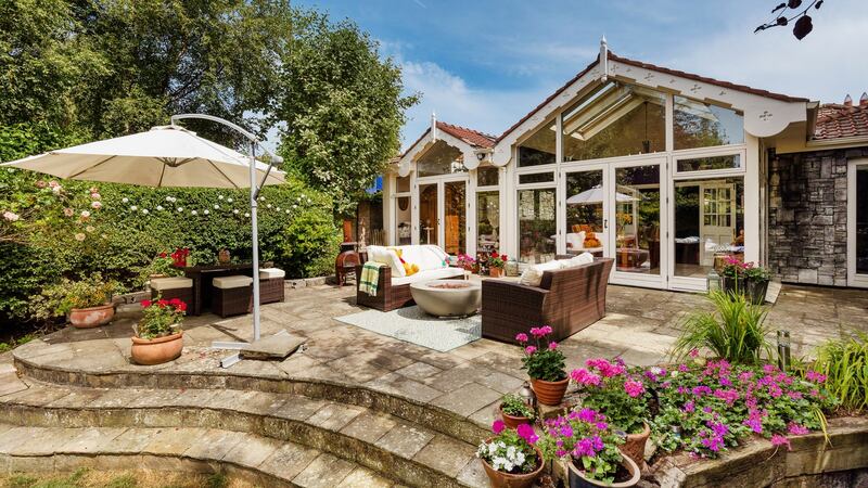 The main bedroom, dining room and kitchen open to the patio