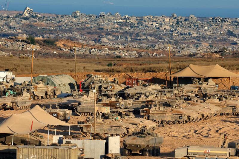 Israeli troops are positioned along the border fence between Israel and the Gaza Strip. Photograph: Jack Guez/AFP/Getty