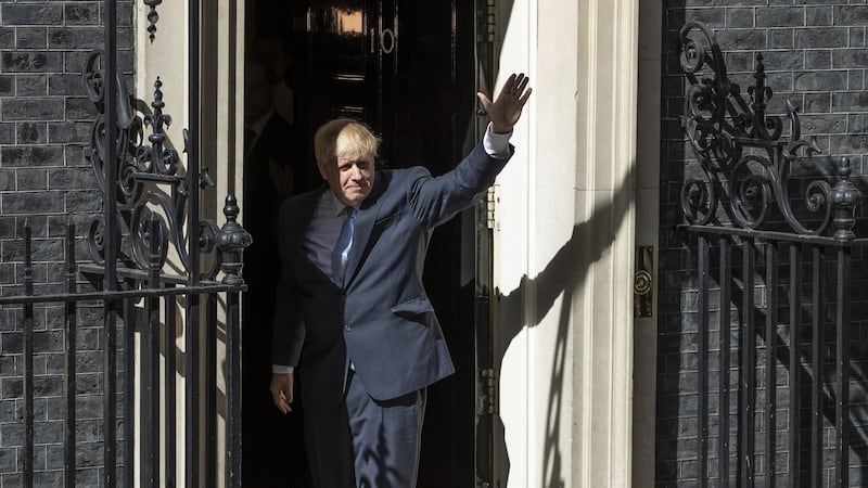 Boris Johnson waving from the door of Number 10. Photograph: Dan Kitwood/Getty Images