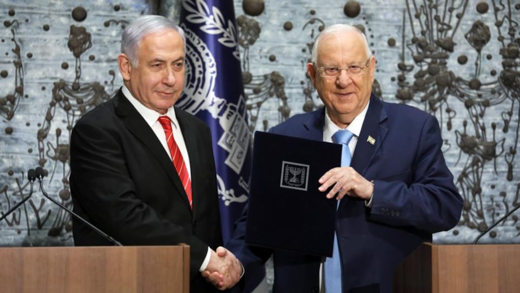 Israeli president Reuven Rivlin (right) hands a letter of appointment for entrusted with forming the next government to Israeli prime minister and Chairman of the Likud Party Benjamin Netanyahu at the President’s residence in Jerusalem on Wednesday. Photograph: Abir Sultan/EPA