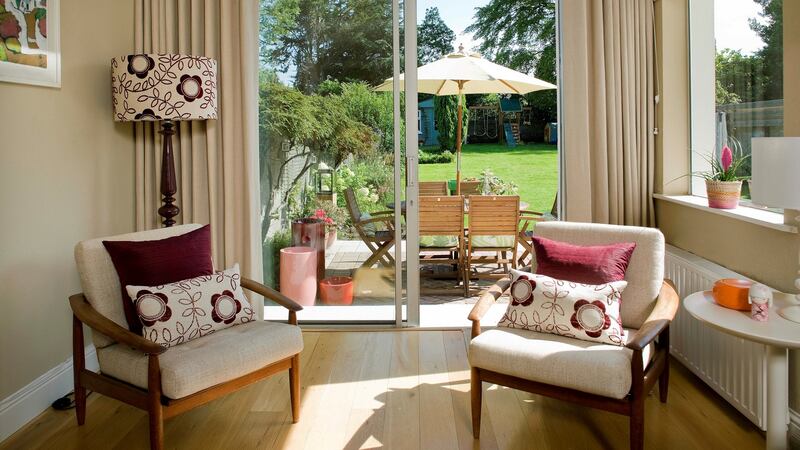 Two mid-century chairs recovered in fabric from the Conran shop