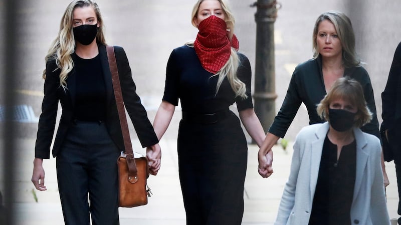 US actress Amber Heard (C)arrives at the Royal Courts of Justice in London. Photograph: Facundo Arrizabalaga/EPA