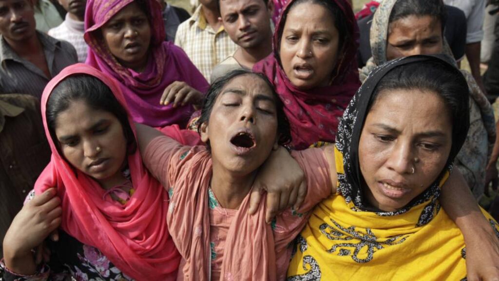 Relatives mourn the death of a garment worker in a fire at the Tazreen Fashion factory in the Ashulia industrial belt of Dhaka in November 2012. Photograph: Andrew Biraj/Reuters