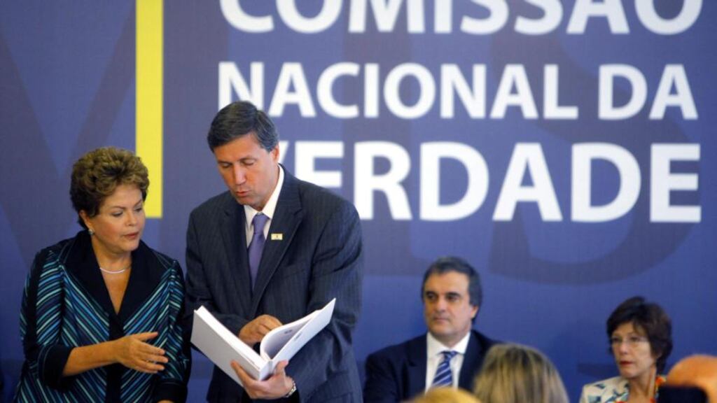 Brazilian President Dilma Rousseff (left) receives the final report of the Commission of Truth about human rights violations during the last dictatorship (1964-1985) from the Commission of Truth coordinator Pedro Dallari, at Planalto Palace in Brasilia, Brazil. Photograph: Fernando Bizzera Jr/EPA