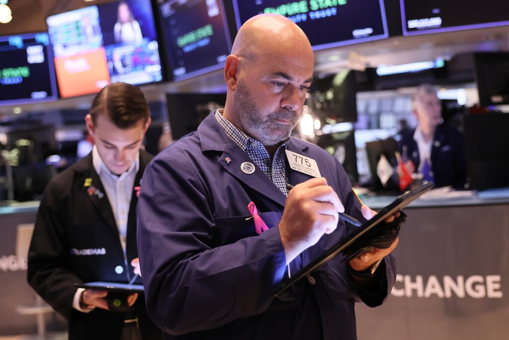 Traders on the New York Stock Exchange. The three main US indexes rose on Wednesday, while treasury yields pulled back from their multiyear highs. Photograph: Michael M. Santiago/Getty Images