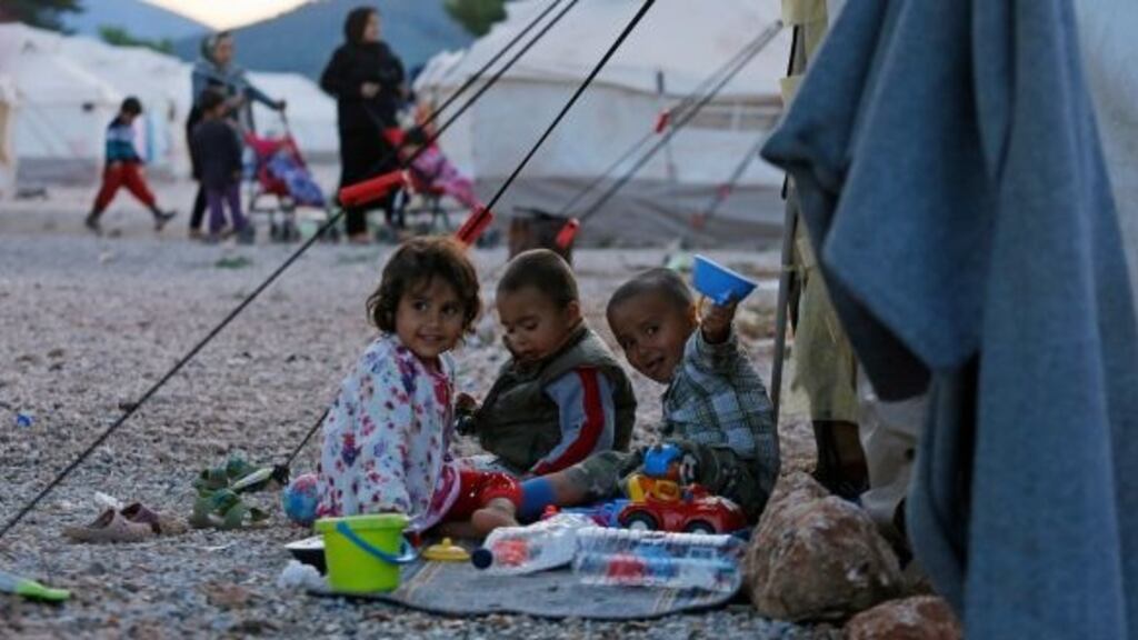 Refugee children play outside a tent in a camp in Malakasa, 40km north of Athens, Greece in May earlier this year.Photograph: Milos Bicanski/Getty Images