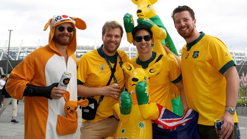 Australian fans pose for a photo outside the stadium. Photograph: Mark Kolbe/Getty Images
