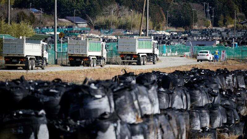 Trucks carry contaminated debris near the crippled Fukushima Daiichi nuclear power plant in Fukushima prefecture, last month. Photograph: Franck Robichon/EPA