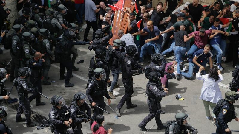 Israeli police confront with mourners as they carry the casket of slain Al Jazeera veteran journalist Shireen Abu Akleh during her funeral in east Jerusalem, Friday, May 13th. Photograph: AP Photo/Maya Levin