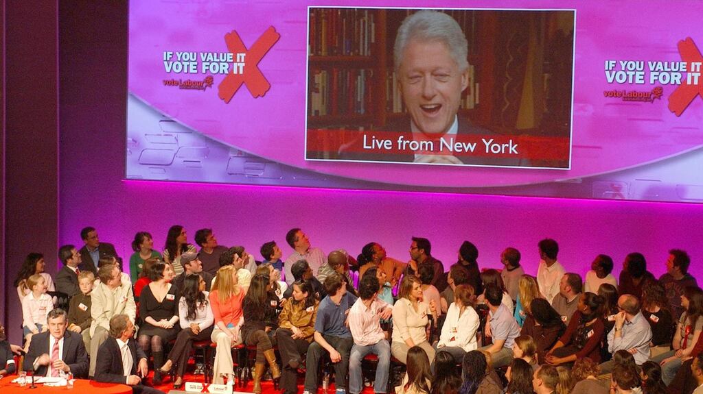 British prime minister Tony Blair and chancellor of the exchequer Gordon Brown listen as former US president Bill Clinton speaks via satellite link at a Labour Party election rally in 2005. Photograph: Martyn Hayhow/AFP via Getty Images