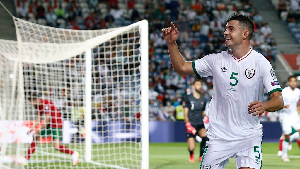 John Egan celebrates after scoring Ireland’s first-half goal against Portugal. Photograph: Antonio Cotrim/EPA
