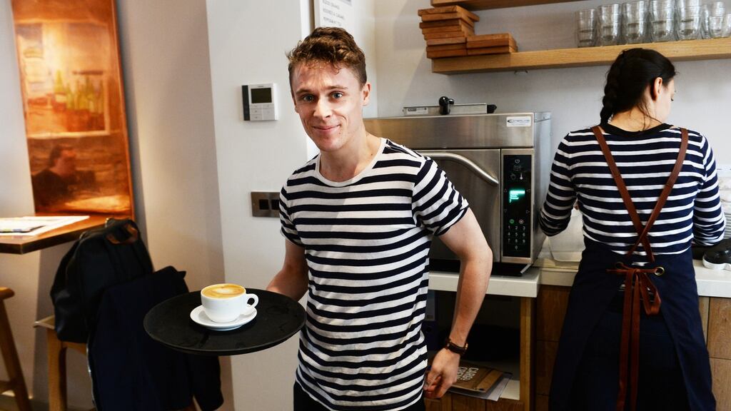 Fionn Rogan working at Java Republic on Molesworth Street. He sparked a debate this week when he wrote about how his generation was being increasingly infantilised, due to soaring rents and a loss of financial independence. Photograph: Cyril Byrne/The Irish Times