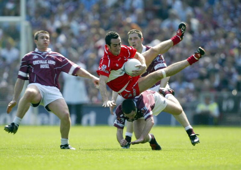 Derry's James Donaghy retains possession despite the efforts of Westmeath's Paul Conway and Fergal Wilson in the 2004 All-Ireland quarter-final. Photograph: Donall Farmer/Inpho