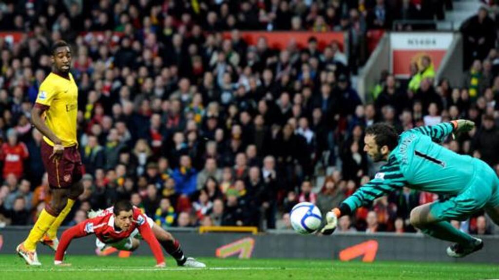 Manuel Almunia saves Javier Hernandez’s header only for Fabio Da Silva to turn the ball home. Photograph: Russell Cheyne/Reuters