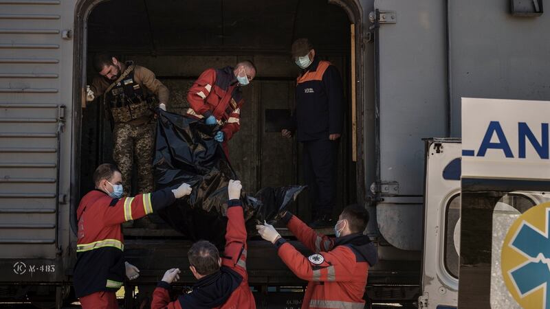 The bodies of more than 40 Russian soldiers who were found after battles around Kharkiv are being stored in refrigerated trains in Ukraine. Photograph: Felipe Dana/AP Photo