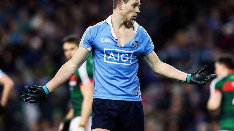 Dean Rock had his jersey torn open. Photo:Tommy Dickson/Inpho