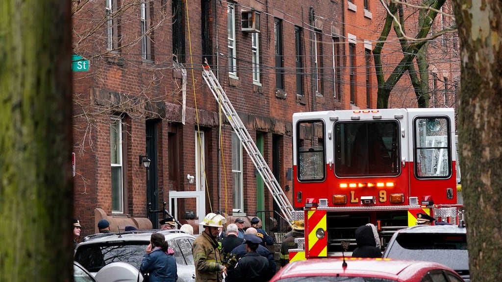 Philadelphia firefighters work at the scene of a deadly fire in the Fairmount neighbourhood of the US city. Photograph: AP Photo/Matt Rourke