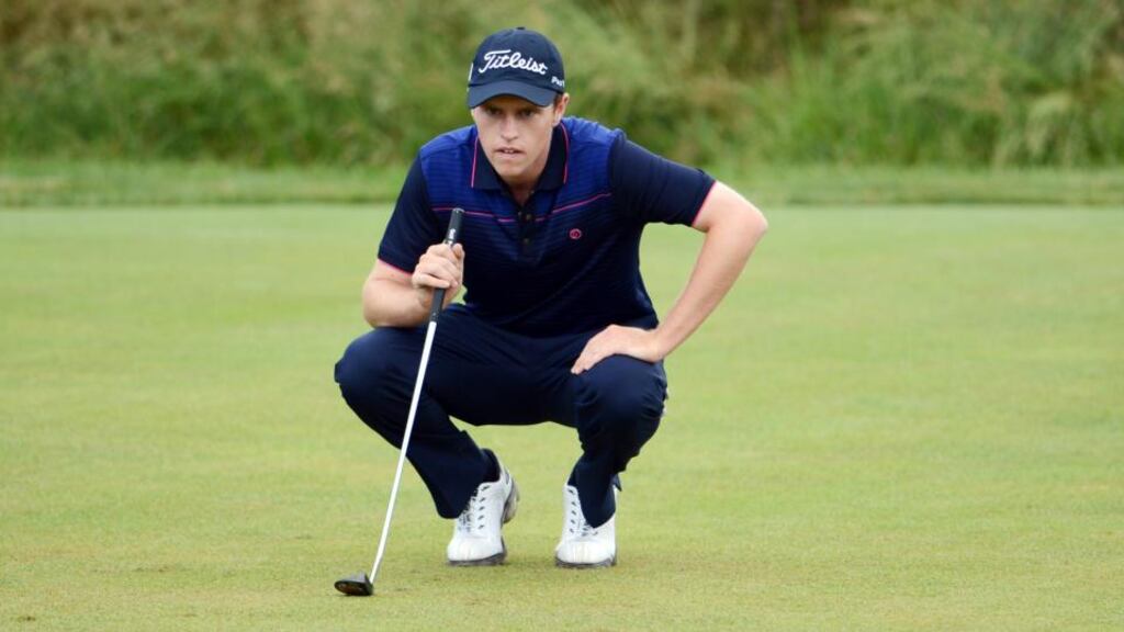 Amateur Kevin Phelan from Waterford lines up a putt on the 17th hole during Round One of the 113th US Open at Merion Golf Club yesterday. Photograph: David Cannon/Getty Images