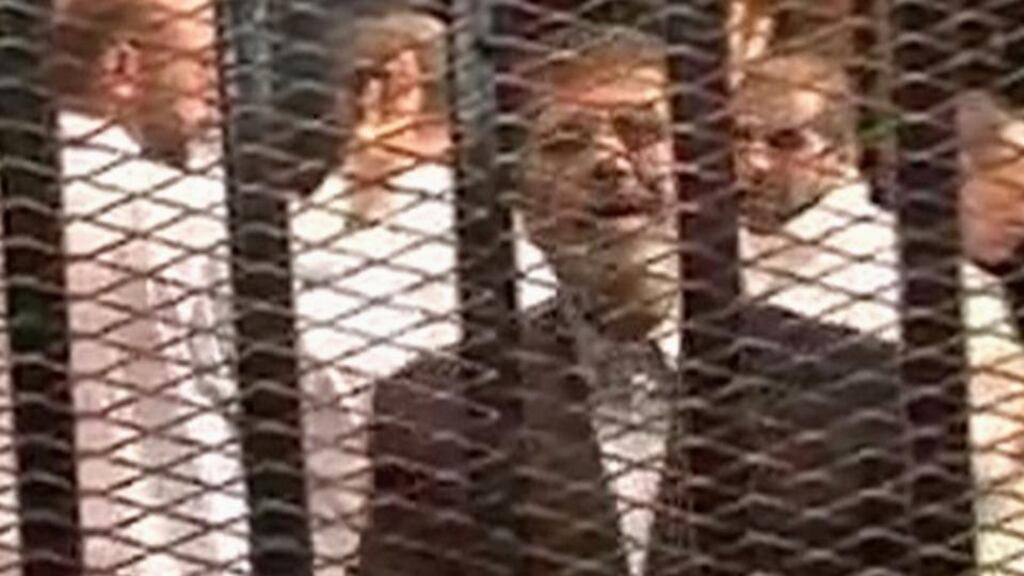 Ousted former Egyptian president Mohamed Morsi stands in a cage in a courthouse on the first day of his trial in Cairo last week. Photograph: Reuters