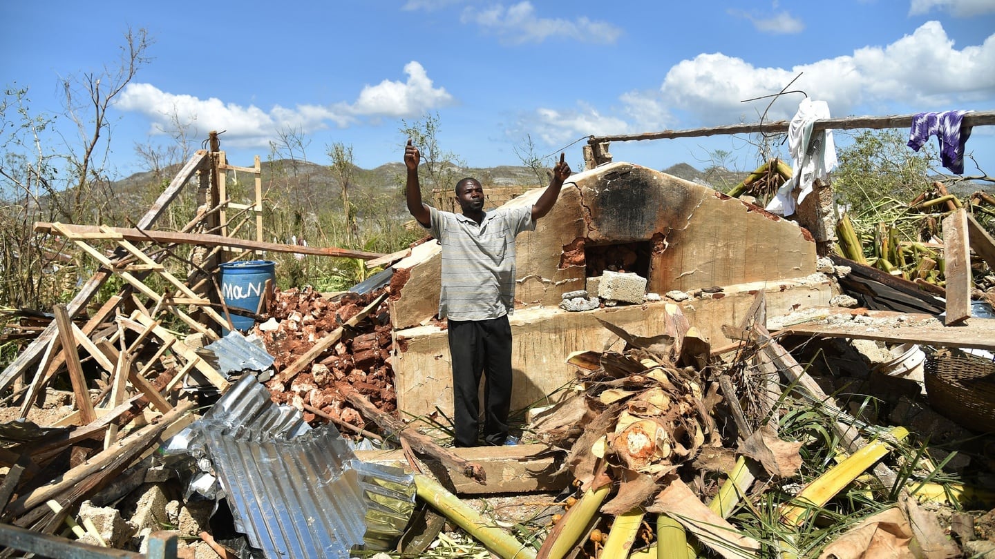A man gestures while standing in what remains of his house that was damaged in hurricane Matthew, in Deson, near Les Cayes in southwest Haiti, on Friday. Photograph: AFP/Getty Images