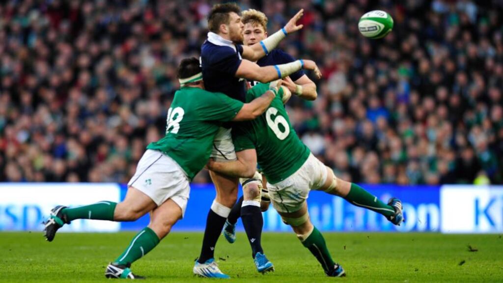 Scotland’s Johnnie Beattie is tackled by Ireland’s Peter O’Mahony (right) and Martin Moore at the Aviva Stadium. Photograph: Aidan Crawley/EPA