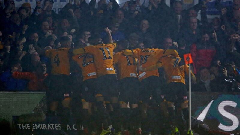Newport players celebrate after Amond’s goal. Photo: Geoff Caddick/Getty Images