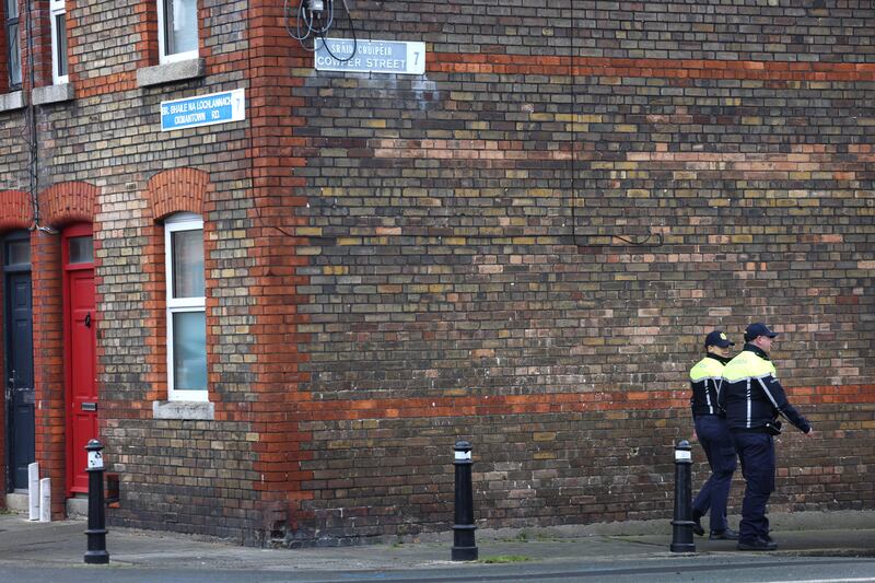 Gardaí patrol on the corner of Oxmantown Road and Cowper Street, Stoneybatter on Monday following a knife attack. Photograph: Dara Mac Dónaill