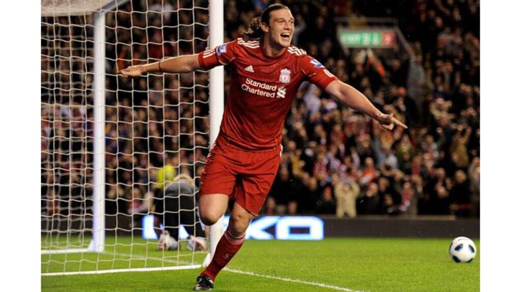 Andy Carroll of Liverpool celebrates scoring his team's third goal during the Premier League match against Manchester City at Anfield. Photograph: Michael Regan/Getty Images