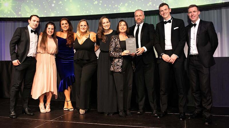 Margaret Colton, Head of Marketing, Dunnes Stores, presents the Best Sponsorship Team - Agency award to the TITAN Experience Team.