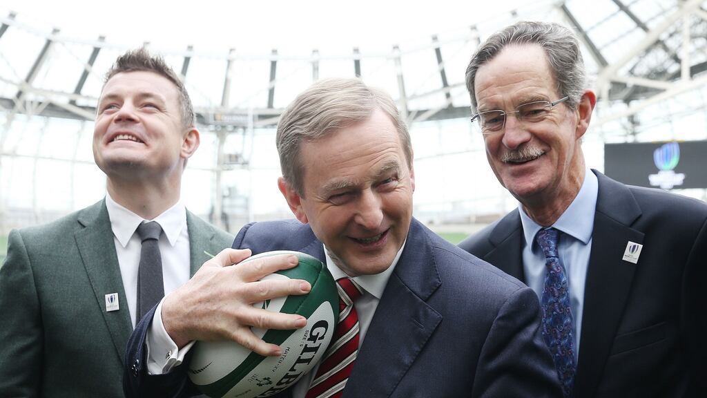 Taoiseach Enda Kenny with former Ireland international Brian O’Driscoll and Dick Spring, chairman of Ireland’s RWC 2023 Bid Oversight Board, at the Aviva Stadium on Tuesday. Photograph: Brian Lawless/PA