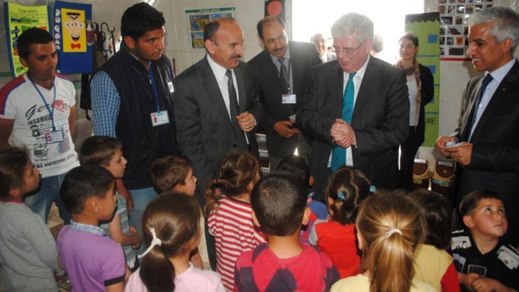 Mr Gilmore visiting the Nazip camp near the city of Gaziantep, close to the Syrian border, yesterday